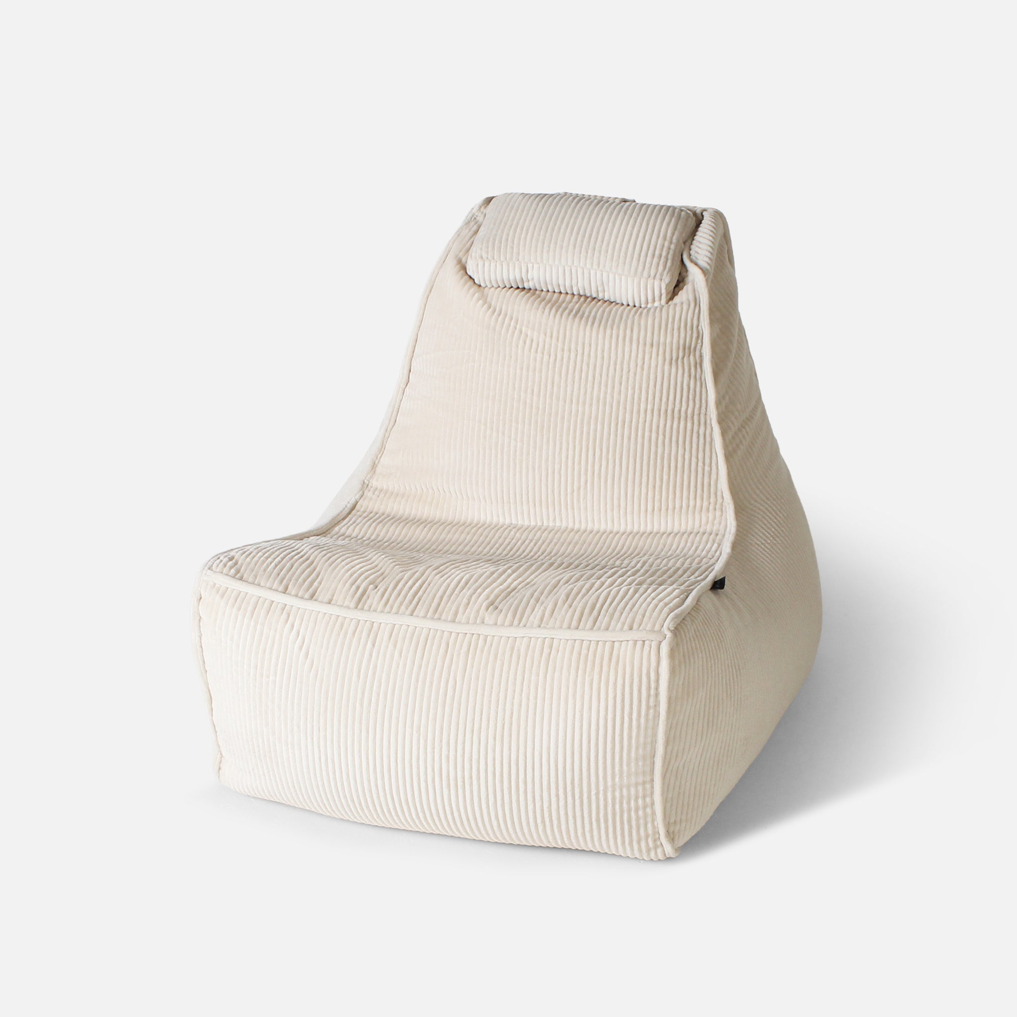 Beige jumbo corduroy ambient lounge Calmera chair on a white background