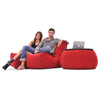 red indoor couch by Ambient Lounge